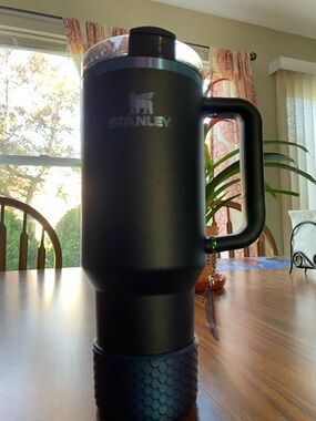 Used once. Stanley Black Travel Tumbler with blue purple iridescent Logo